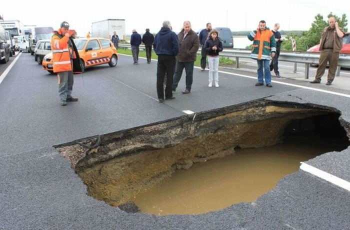 Rainwater sinkhole on highway, Hungary