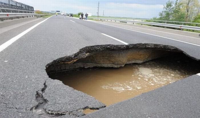 Rainwater sinkhole on highway, Hungary