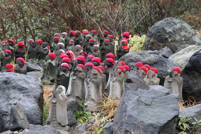 Jizo statues near volcano, Japan