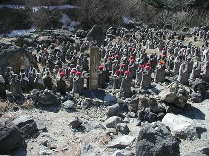 Jizo statues near volcano, Japan