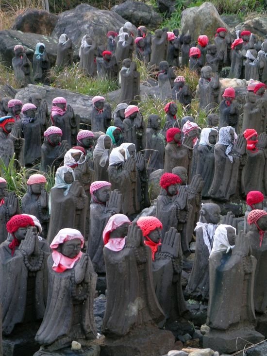 Jizo statues near volcano, Japan