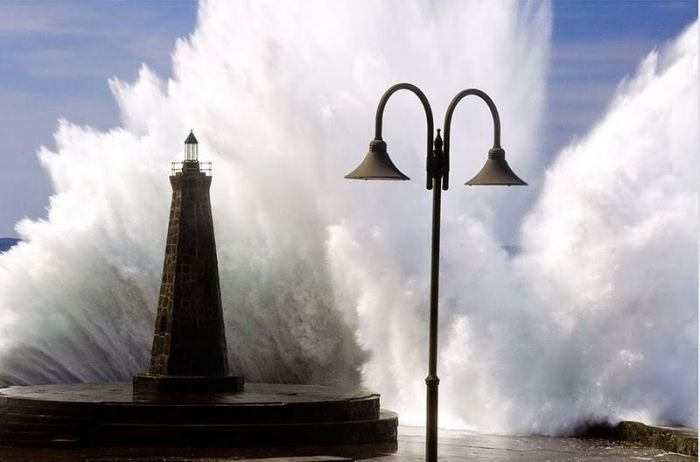 lighthouse in waves