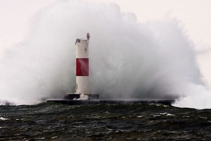 lighthouse in waves