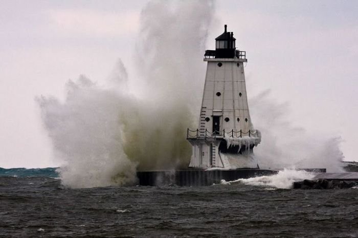 lighthouse in waves