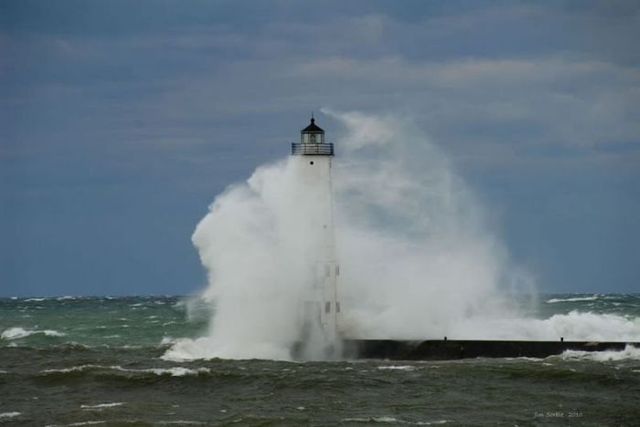 lighthouse in waves