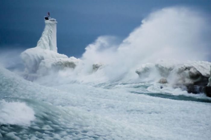 lighthouse in waves