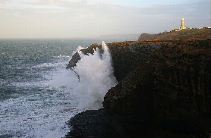 lighthouse in waves