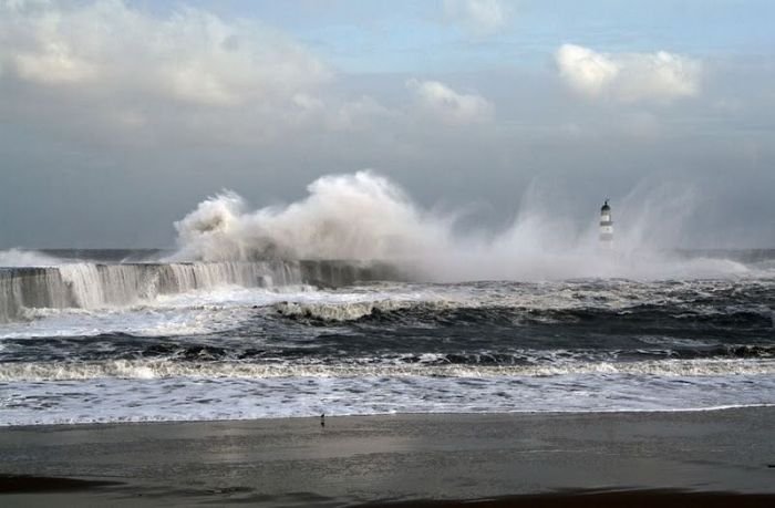 lighthouse in waves