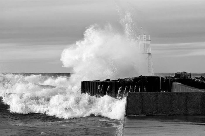 lighthouse in waves