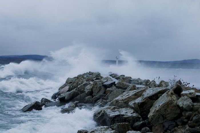 lighthouse in waves