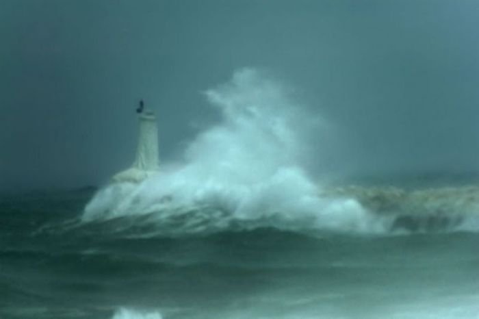 lighthouse in waves