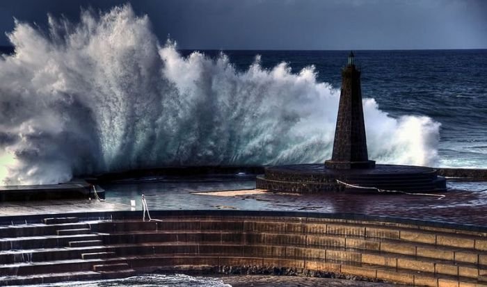 lighthouse in waves