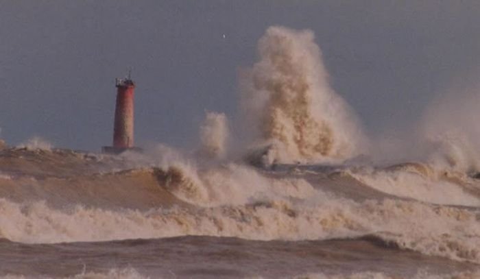 lighthouse in waves