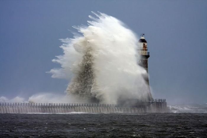 lighthouse in waves