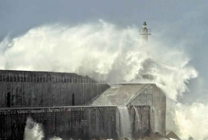 lighthouse in waves