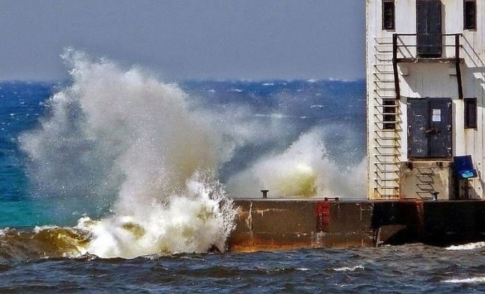 lighthouse in waves