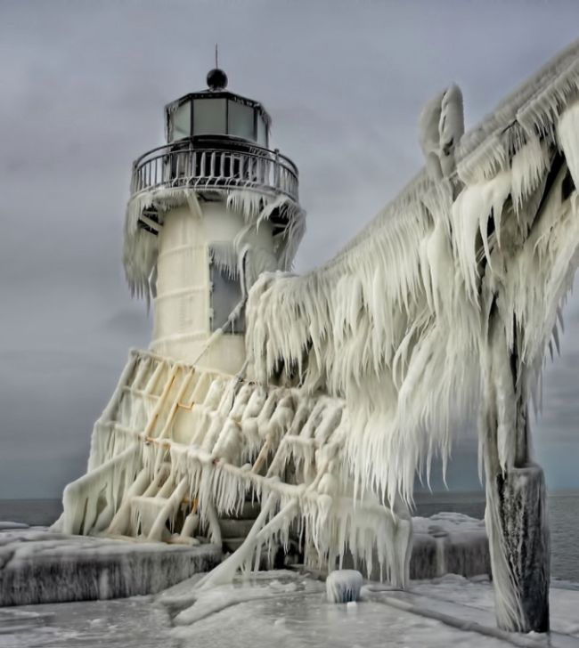 Frozen lighthouse, St. Joseph North Pier, Lake Michigan, North America