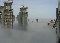 Trek.Today search results: bird's-eye view of buildings above the clouds