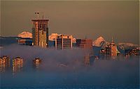 Trek.Today search results: bird's-eye view of buildings above the clouds