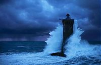 World & Travel: Lighthouse in the storm, France