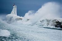 World & Travel: lighthouse in waves