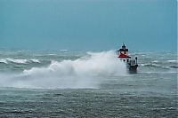 World & Travel: lighthouse in waves