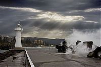 World & Travel: lighthouse in waves