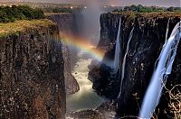 World & Travel: Rainbow over Victoria Falls, Zambezi River, Africa