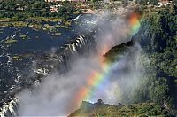 World & Travel: Rainbow over Victoria Falls, Zambezi River, Africa