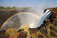 World & Travel: Rainbow over Victoria Falls, Zambezi River, Africa